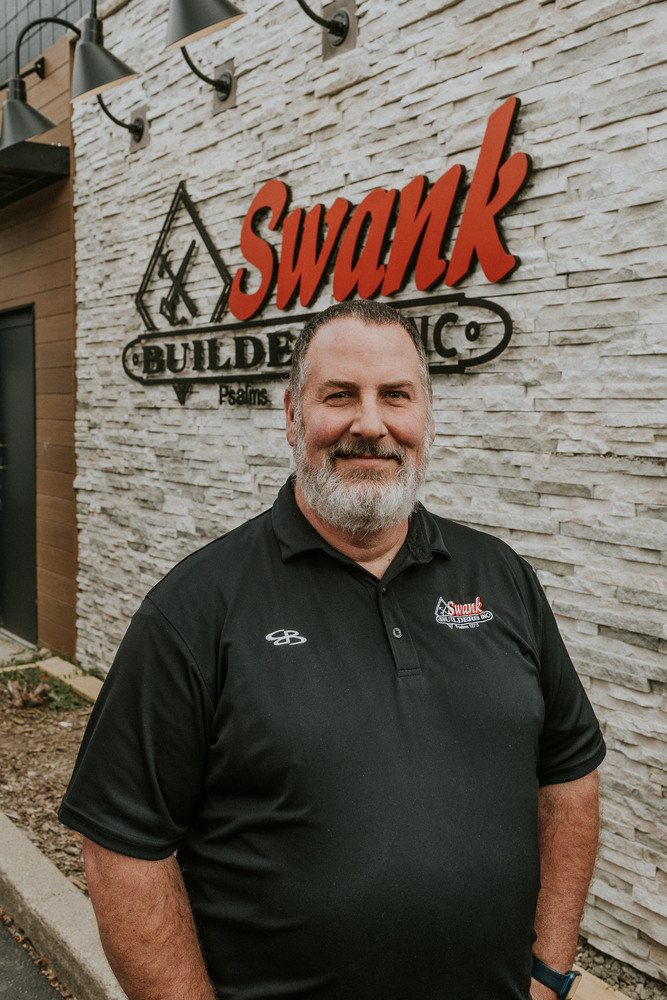Jeff Cox of Swank Builders Inc custom home builder team member portrait outside office in Genesee County MI