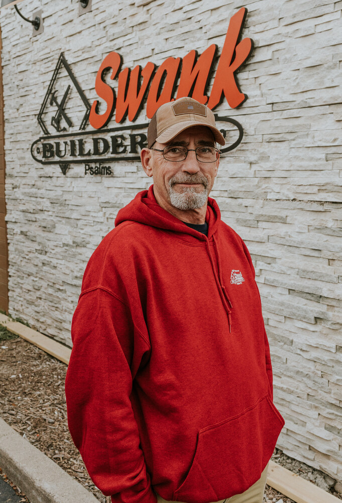 Matt Hall of Swank Builders Inc custom home builder team member portrait outside office in Genesee County MI