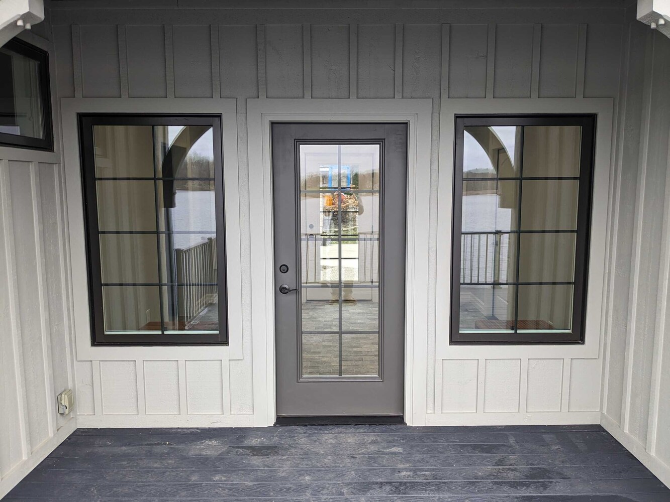 breezeway addition exterior by Swank Builders Inc featuring covered porch and waterfront deck in Fenton MI