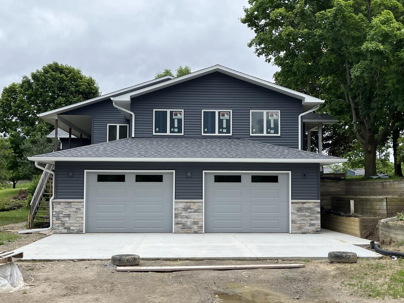 Swank Builders Inc additions project finished home addition with new garage and upper level in Fenton MI
