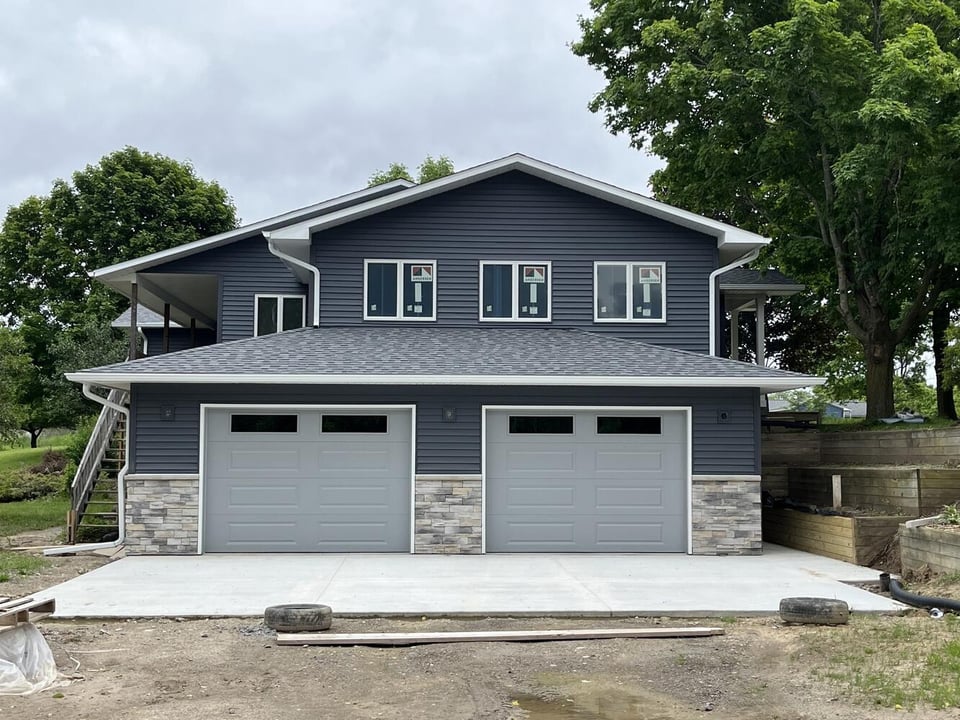 Swank Builders Inc additions project finished home addition with new garage and upper level in Fenton MI