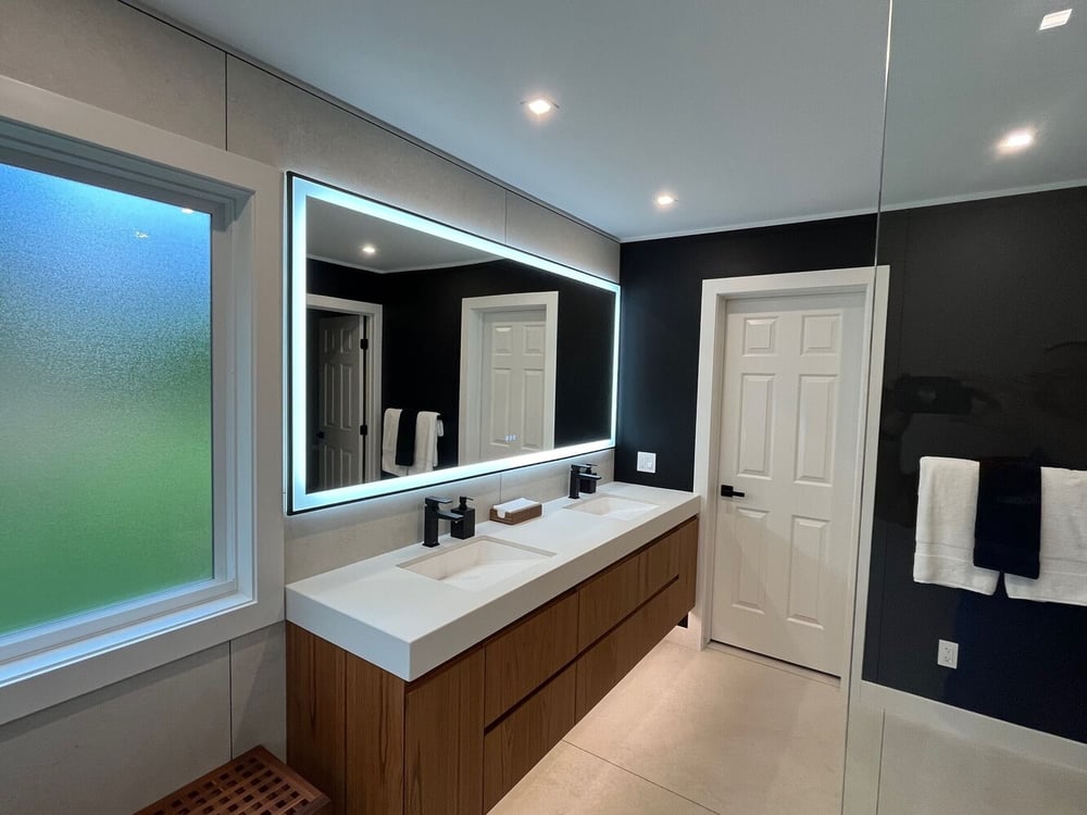 bathroom remodel with dual sinks and built in storage tower by Swank Builders Inc in Burton MI