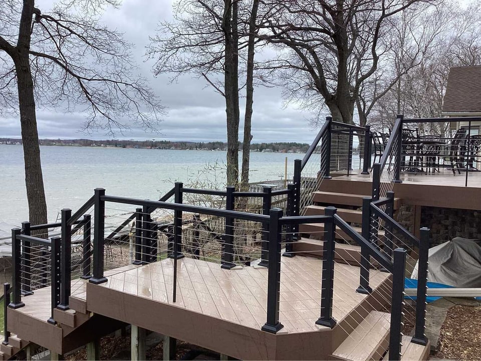 Swank Builders Inc custom long deck with railing system and outdoor living space in Oakland County MI
