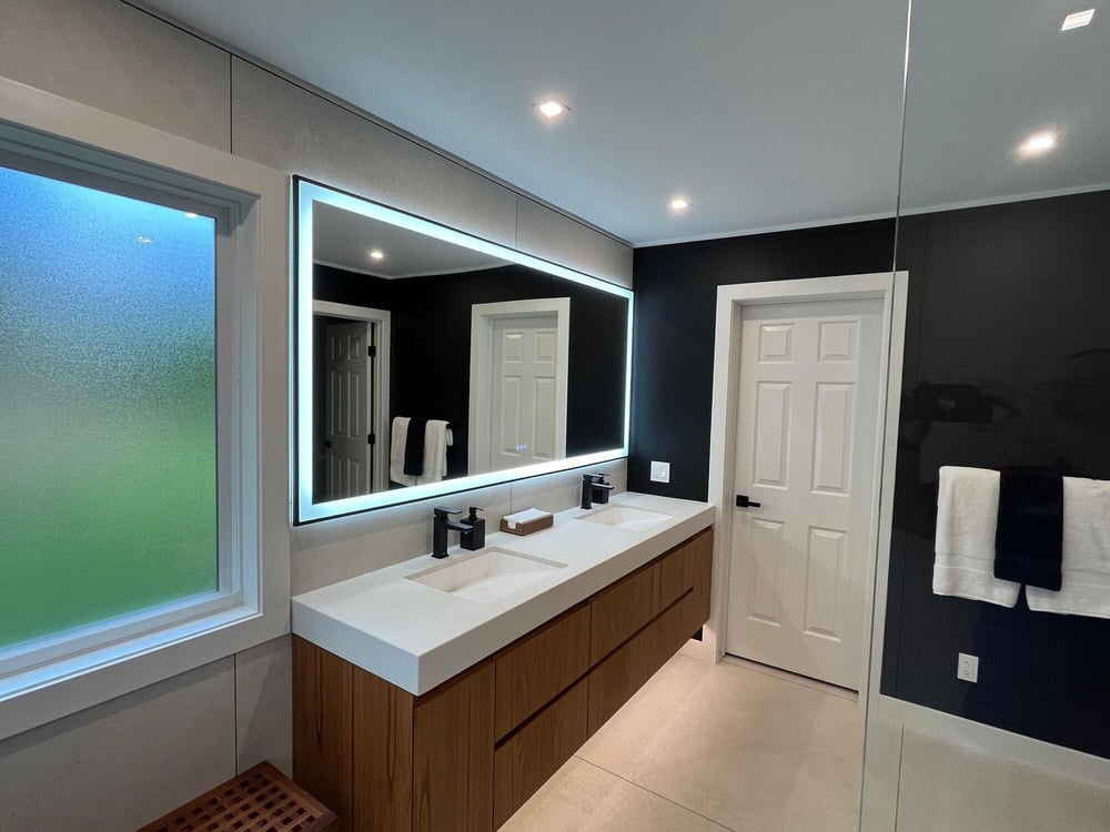 bathroom remodel with dual sinks and built in storage tower by Swank Builders Inc in Burton MI