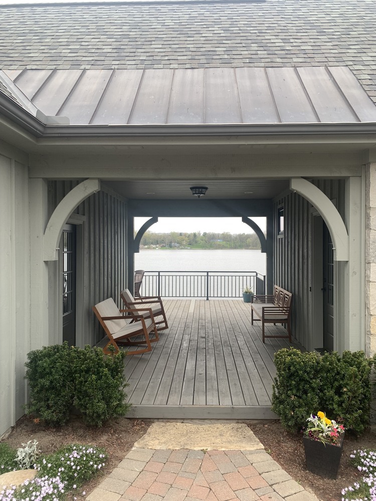 breezeway addition before construction showing original deck entry in Fenton MI by Swank Builders Inc - Before