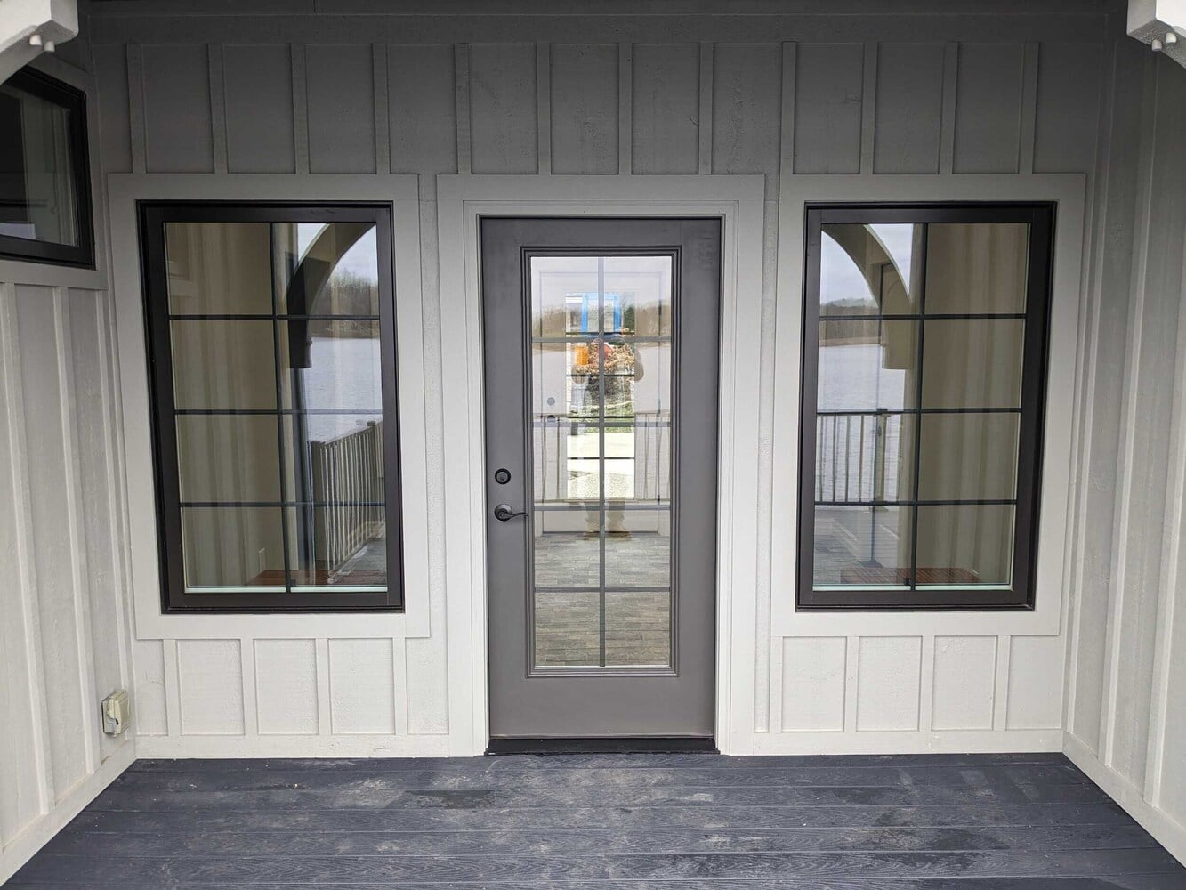 breezeway addition exterior by Swank Builders Inc featuring covered porch and waterfront deck in Fenton MI