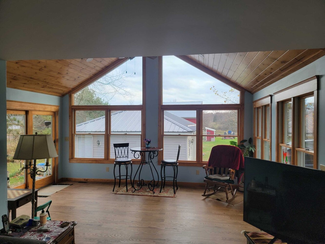 custom home sunroom addition with vaulted ceiling by Swank Builders Inc in Fenton MI