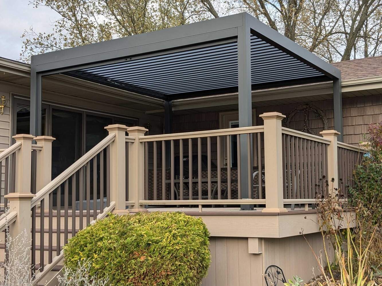 Swank Builders Inc custom outdoor pergola providing shade and airflow on composite deck in Michigan