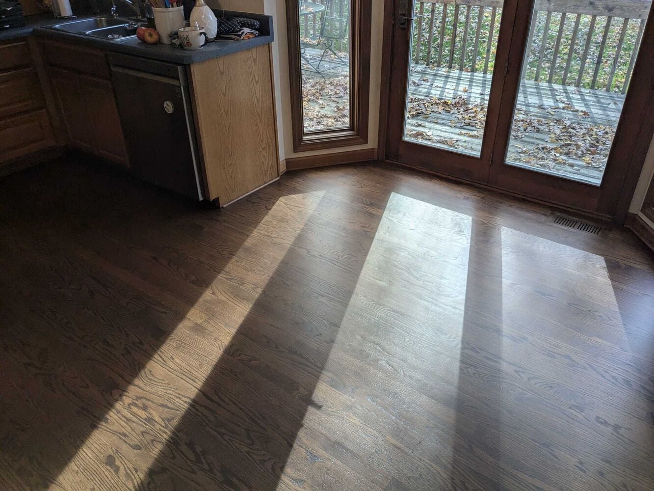 Swank Builders Inc hardwood floor refinishing with natural sunlight finish in Flushing MI
